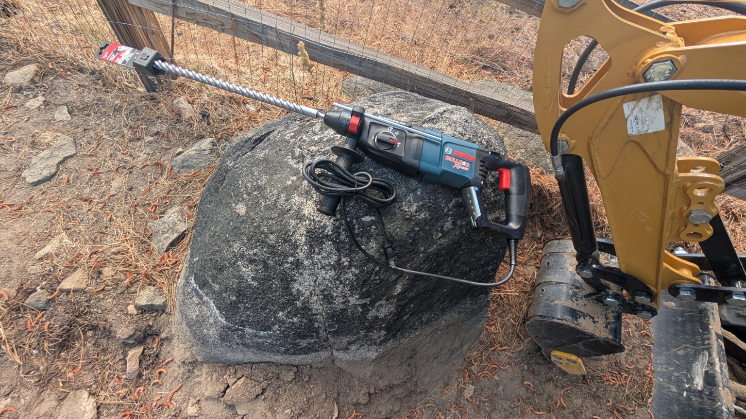 Rotary hammer on top of granite boulder